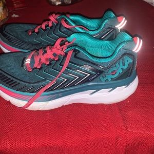 Women HOKA green and pink shoes